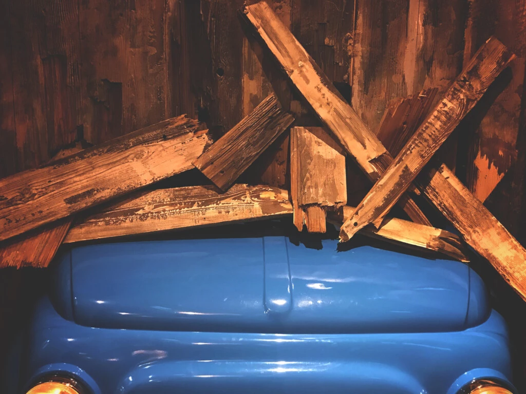 A driver crashed in a Fresno home, damaging their front fence and car.