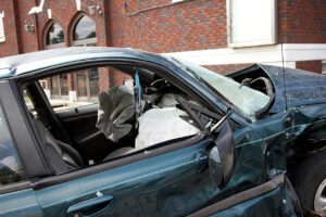 One killed in multi-vehicle crash in Los Angeles that causes a car to crash into a building.